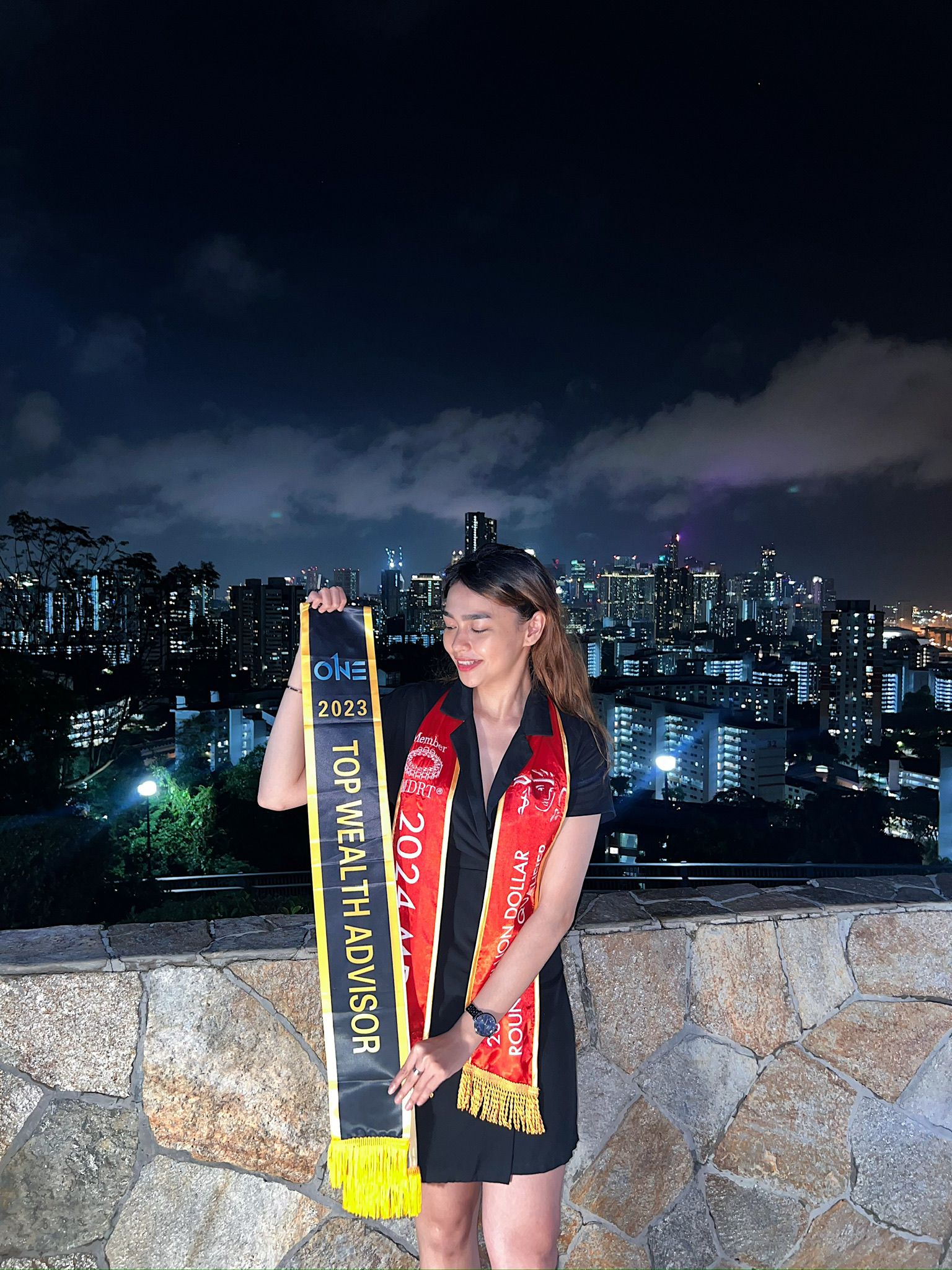 Syarafana wearing her 2024 Million Dollar Round Table sash